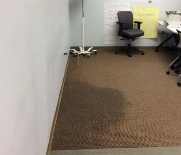 hospital room with water damaged carpet flooring