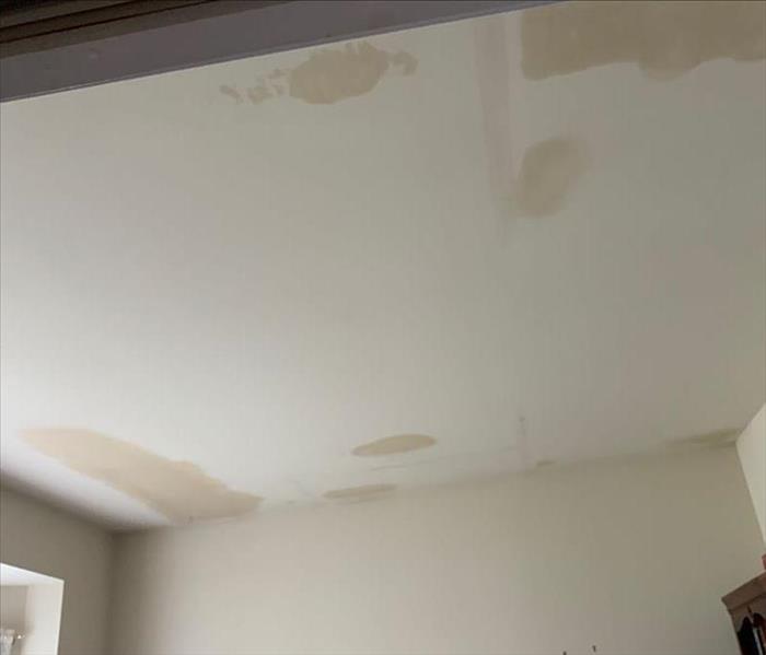 water damaged ceiling with water spots