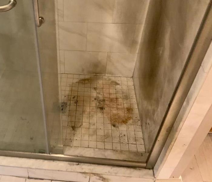 Inside of a shower with burn fire damage